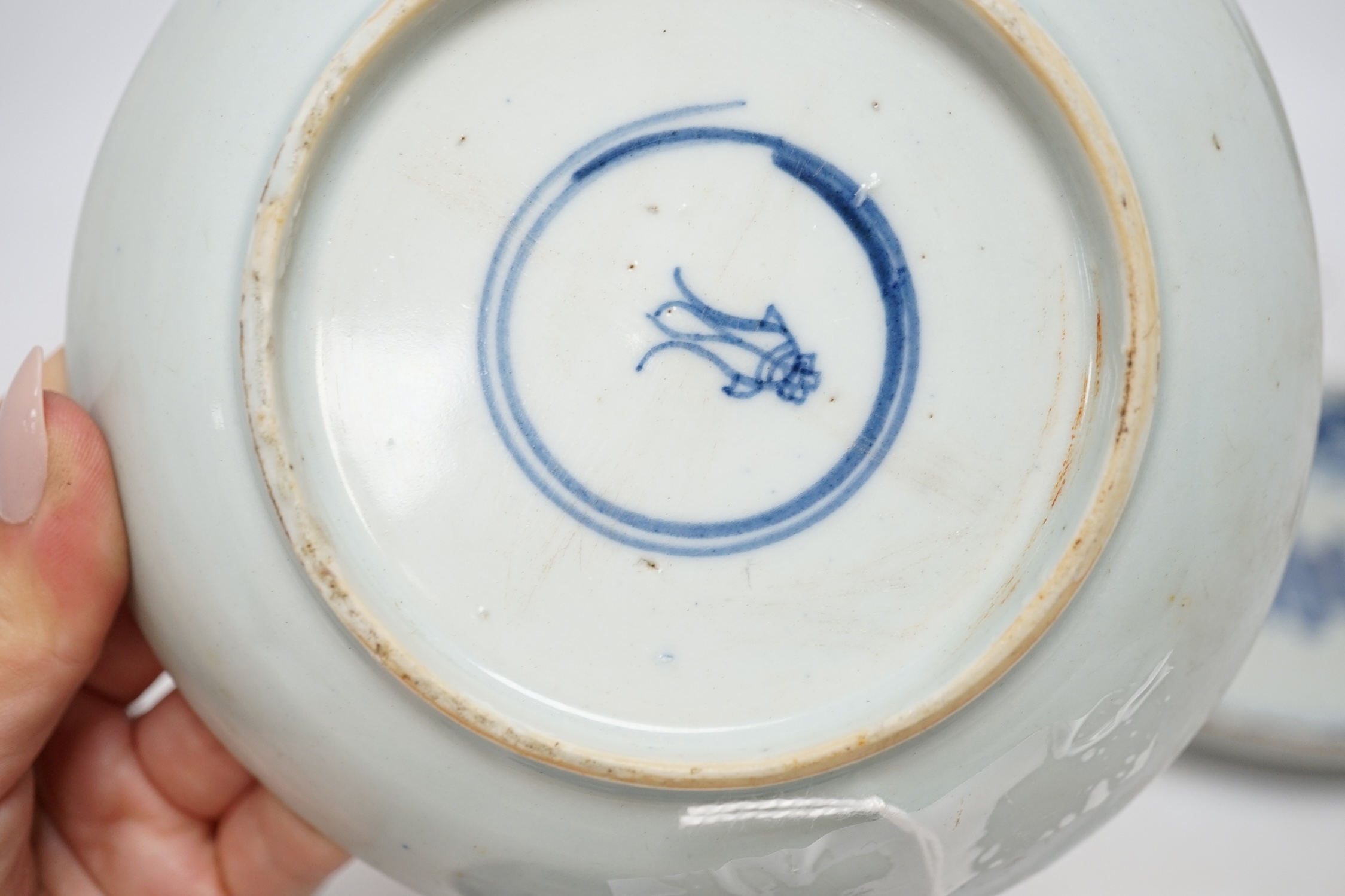 Five variously patterned Chinese blue and white saucer dishes, Kangxi period, largest 16cm diameter. Condition - chips and cracks to three items